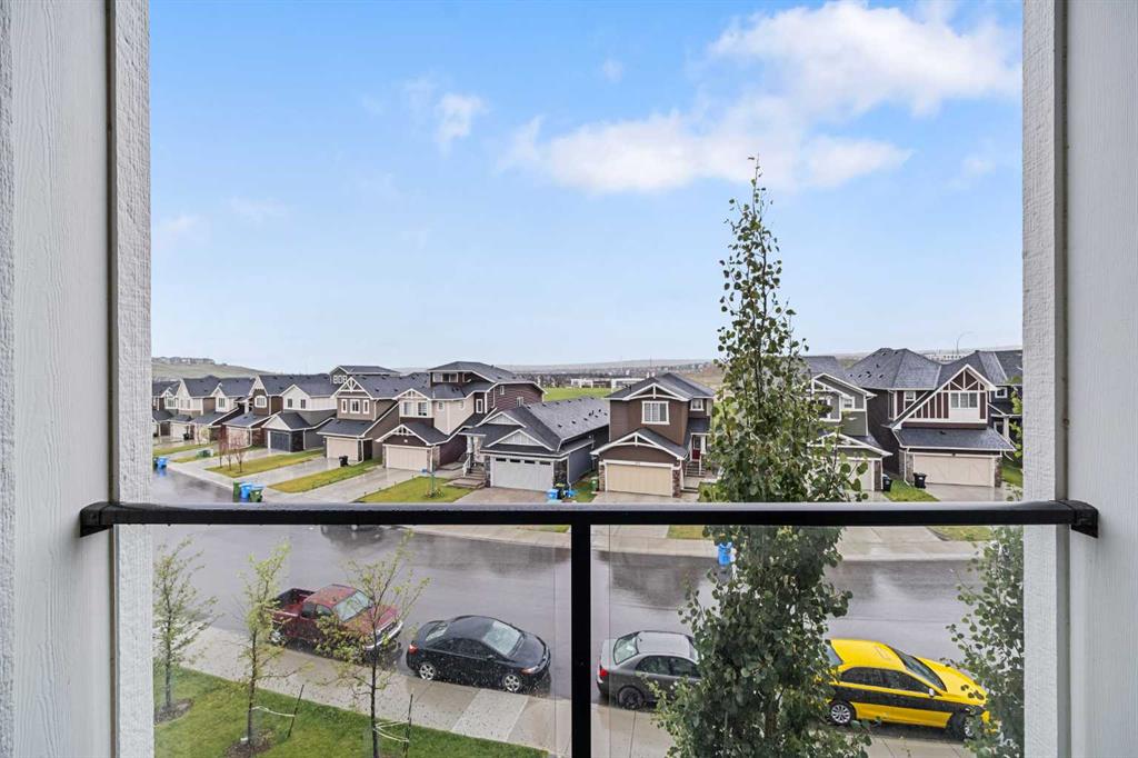 Balcony view overlooking residential street and rooftops in Sage Meadows Park Calgary