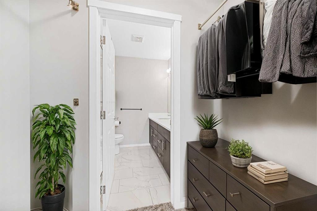 Master ensuite with tiled tub-shower and rainfall showerhead